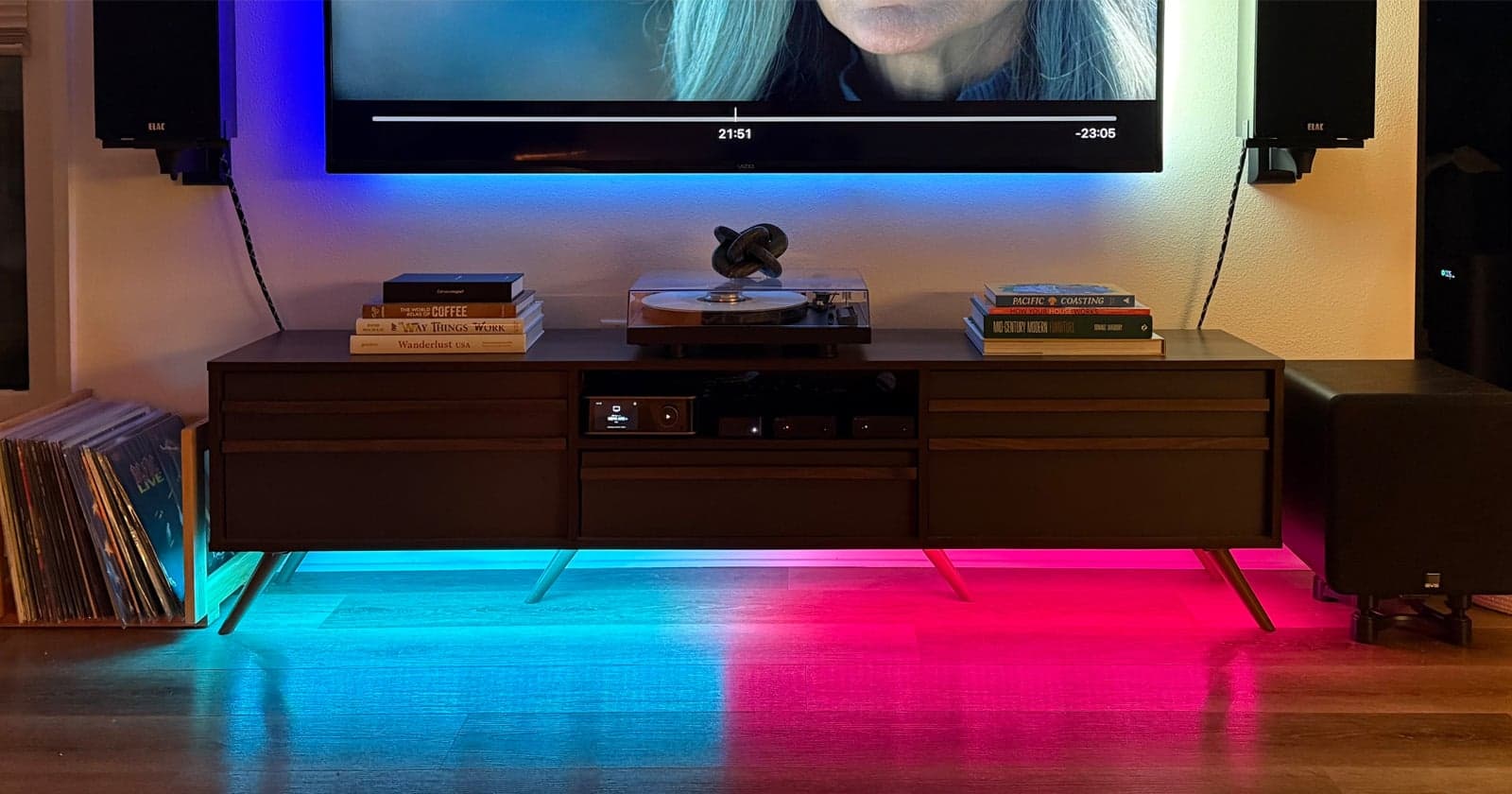 A WLED strip showing Apple TV playback progress beneath a television